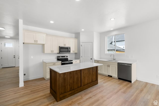 244 E 300 N, Payson, UT 84651 - kitchen with appliances with stainless steel finishes, light countertops, light wood-type flooring, a kitchen island, and recessed lighting