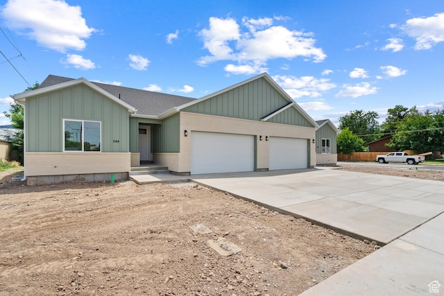 244 E 300 N, Payson, UT 84651 - ranch-style house featuring concrete driveway, board and batten siding, an attached garage, and roof with shingles