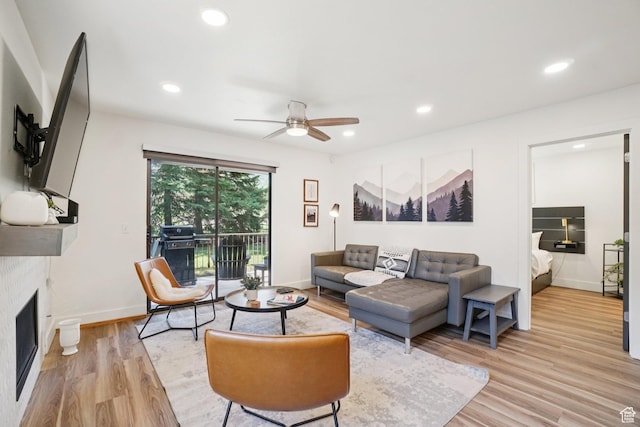 2025 Canyons Resort Dr Unit I1, Park City, UT 84098 - living room featuring a fireplace, light wood finished floors, a ceiling fan, and recessed lighting