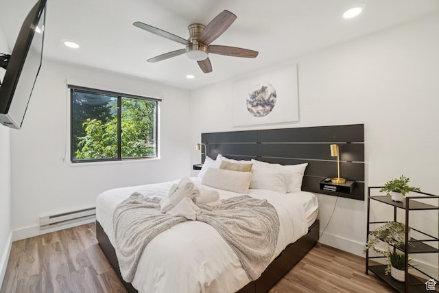 2025 Canyons Resort Dr Unit I1, Park City, UT 84098 - bedroom with a baseboard heating unit, wood finished floors, recessed lighting, and ceiling fan