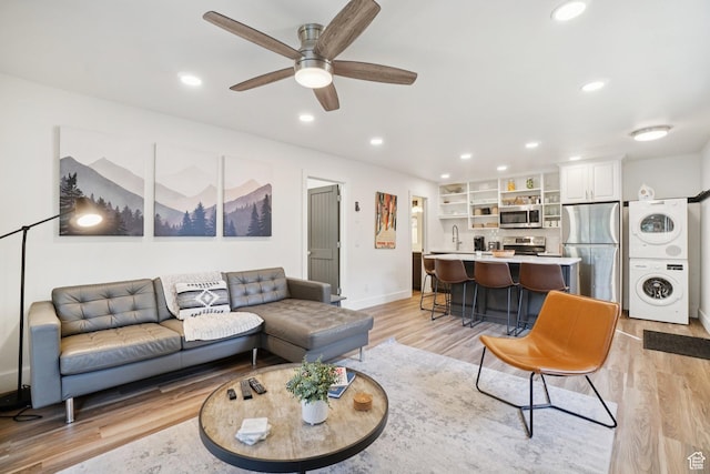 2025 Canyons Resort Dr Unit I1, Park City, UT 84098 - living room featuring stacked washer / drying machine, light wood-style flooring, ceiling fan, and recessed lighting