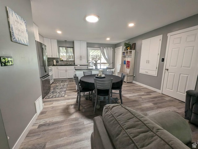 1704 S Sorrento Dr, Woods Cross, UT 84087 - dining room featuring wood finished floors and recessed lighting