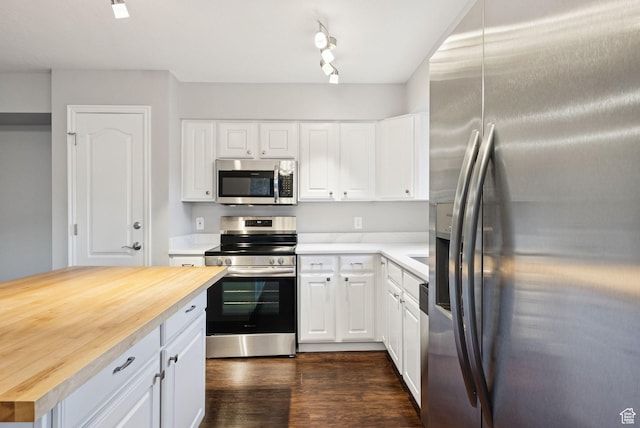 1729 Fox Bay Dr Unit J104, Heber City, UT 84032 - kitchen with appliances with stainless steel finishes, butcher block countertops, white cabinetry, dark wood-style floors, and rail lighting