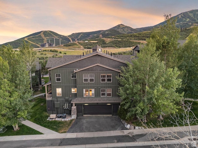 1729 Fox Bay Dr Unit J104, Heber City, UT 84032 - view of front of home with a mountain view, board and batten siding, driveway, and an attached garage