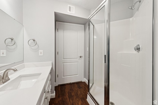 1729 Fox Bay Dr Unit J104, Heber City, UT 84032 - full bath featuring a shower stall, vanity, and wood finished floors