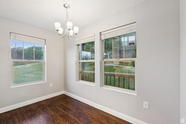 1729 Fox Bay Dr Unit J104, Heber City, UT 84032 - unfurnished room with a chandelier and dark wood-type flooring