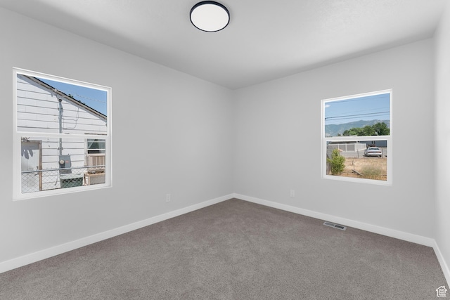 482 N Brook Ave E, Tooele, UT 84074 - carpeted spare room with baseboards