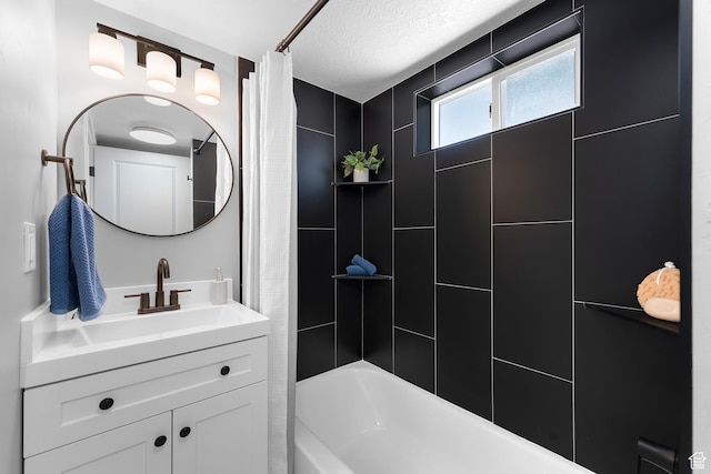 482 N Brook Ave E, Tooele, UT 84074 - bathroom featuring shower / tub combo, vanity, and a textured ceiling