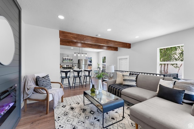 482 N Brook Ave E, Tooele, UT 84074 - living area featuring recessed lighting, light wood finished floors, and beamed ceiling