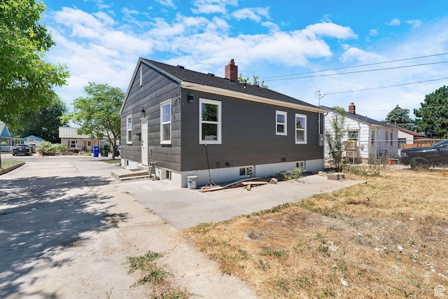 482 N Brook Ave E, Tooele, UT 84074 - view of side of property with a chimney