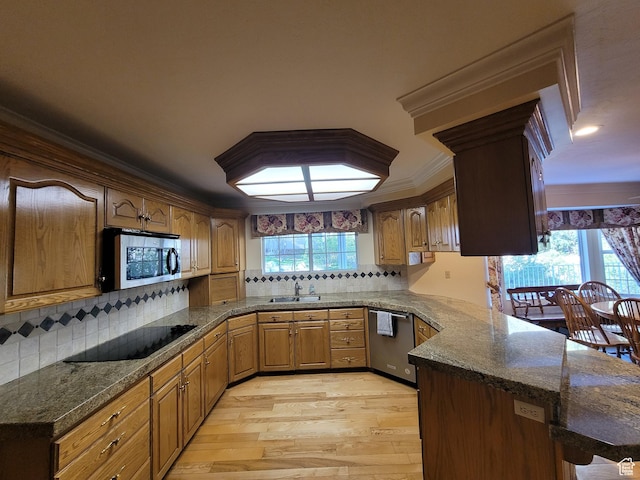 1360 Lakeview Dr, Bountiful, UT 84010 - kitchen with stainless steel appliances, light wood finished floors, a peninsula, decorative backsplash, and ornamental molding