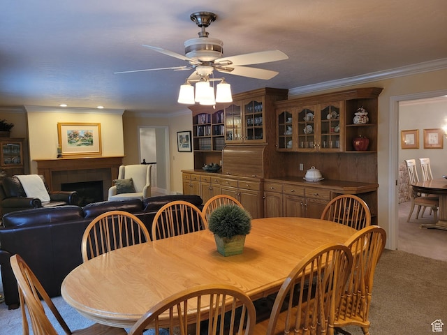 1360 Lakeview Dr, Bountiful, UT 84010 - dining space featuring light carpet, crown molding, a ceiling fan, and a fireplace