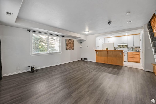 4072 S 300 E Unit 8, Salt Lake City, UT 84107 - unfurnished living room featuring dark wood-style flooring and baseboards