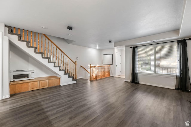 4072 S 300 E Unit 8, Salt Lake City, UT 84107 - unfurnished living room featuring dark wood-style floors and stairs