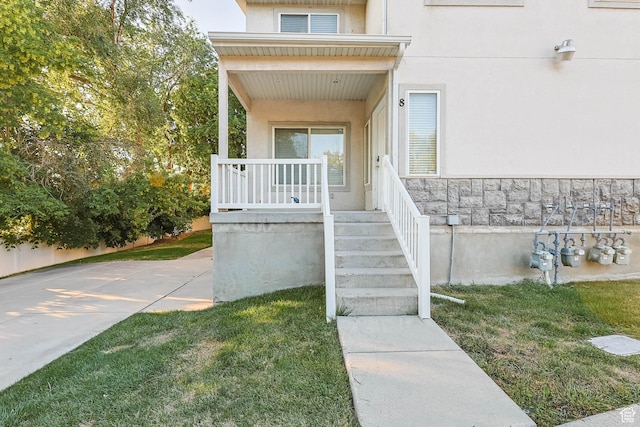 4072 S 300 E Unit 8, Salt Lake City, UT 84107 - entrance to property featuring stucco siding, a porch, and a lawn