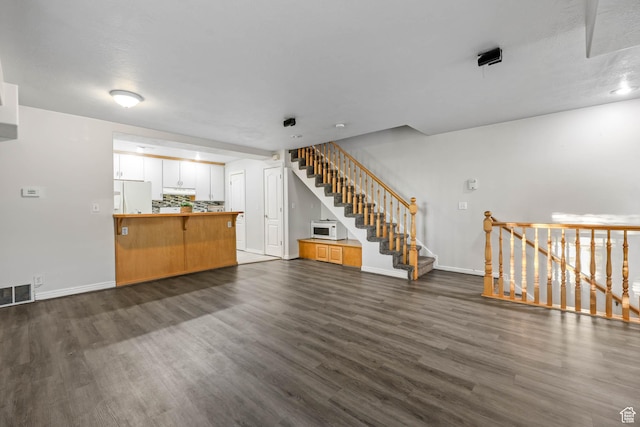 4072 S 300 E Unit 8, Salt Lake City, UT 84107 - unfurnished living room featuring dark wood-style flooring and stairs