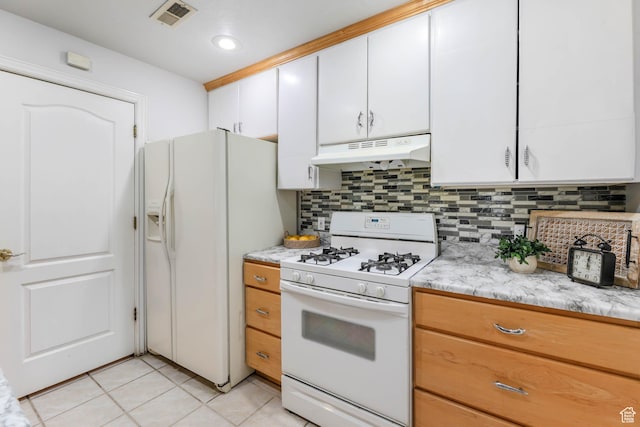 4072 S 300 E Unit 8, Salt Lake City, UT 84107 - kitchen with white appliances, under cabinet range hood, decorative backsplash, light tile patterned floors, and white cabinetry