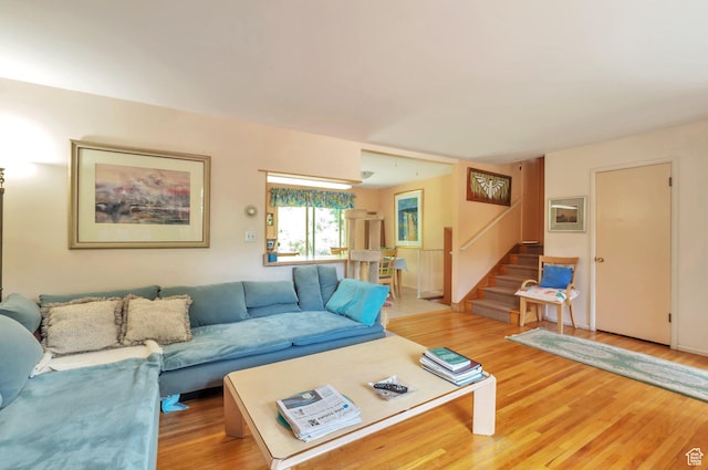 4790 Burch Dr, South Ogden, UT 84403 - living room featuring stairway and light wood-type flooring