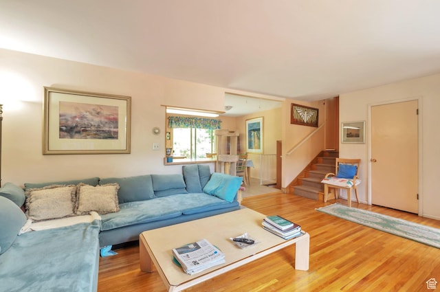 4790 Burch Dr, South Ogden, UT 84403 - living area featuring stairs and light wood-style flooring