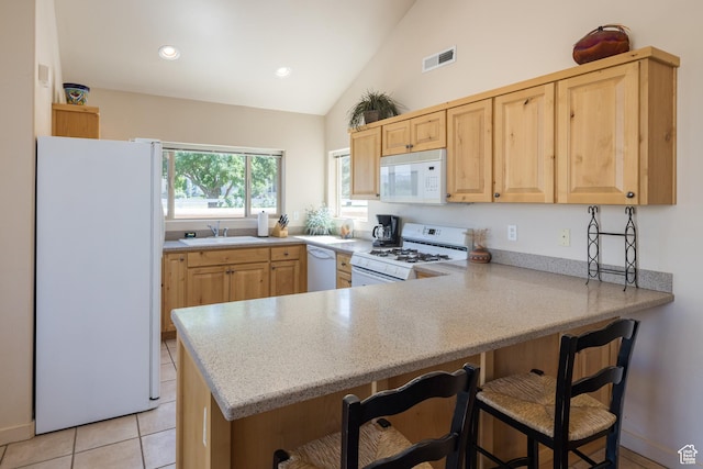 3686 S Spanish Valley Dr Unit N-2, Moab, UT 84532 - kitchen with white appliances, light brown cabinets, light countertops, lofted ceiling, and recessed lighting