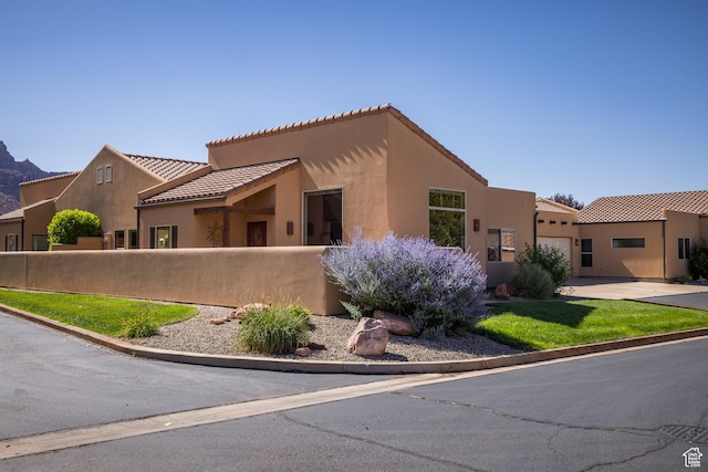 3686 S Spanish Valley Dr Unit N-2, Moab, UT 84532 - view of front of house featuring stucco siding and a tile roof