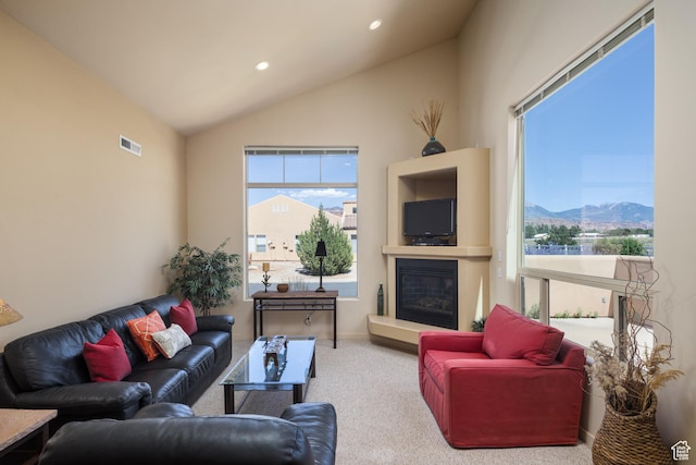 3686 S Spanish Valley Dr Unit N-2, Moab, UT 84532 - living room featuring carpet, a glass covered fireplace, vaulted ceiling, and recessed lighting