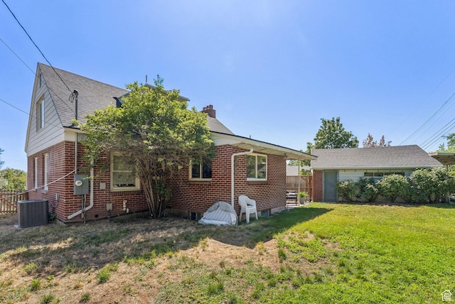 2353 E Logan Cir, Salt Lake City, UT 84108 - view of side of property featuring brick siding and a chimney