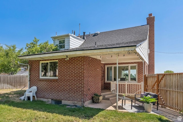 2353 E Logan Cir, Salt Lake City, UT 84108 - rear view of property featuring brick siding and a patio area