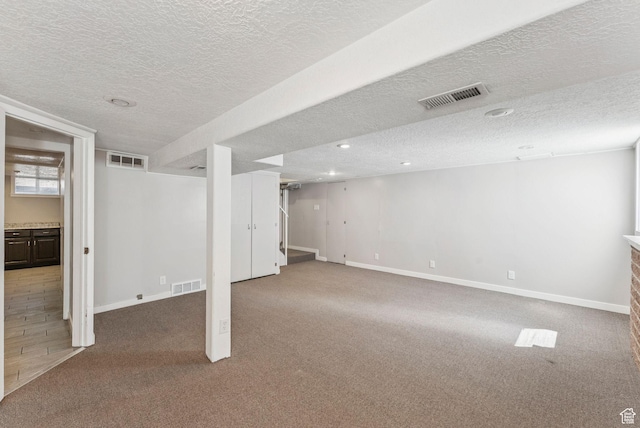 2353 E Logan Cir, Salt Lake City, UT 84108 - below grade area with a textured ceiling, light colored carpet, and recessed lighting