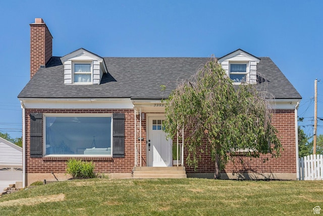 2353 E Logan Cir, Salt Lake City, UT 84108 - cape cod-style house with brick siding, a shingled roof, and a chimney