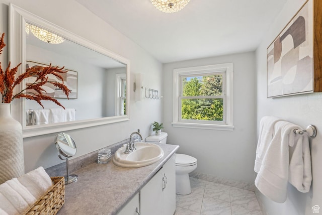 2353 E Logan Cir, Salt Lake City, UT 84108 - bathroom featuring marble look tiles and vanity
