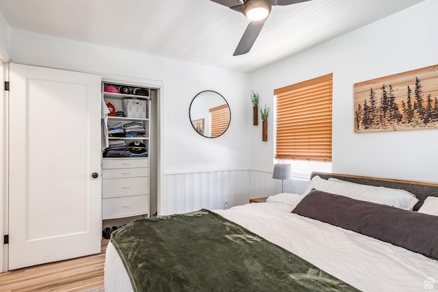 2605 E Simpson Ave, Salt Lake City, UT 84109 - bedroom featuring light wood-type flooring, a wainscoted wall, and a ceiling fan