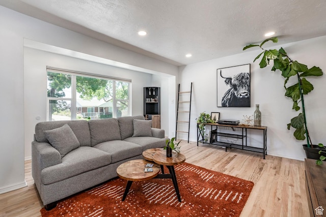 2605 E Simpson Ave, Salt Lake City, UT 84109 - living area with light wood-style floors, recessed lighting, and a textured ceiling