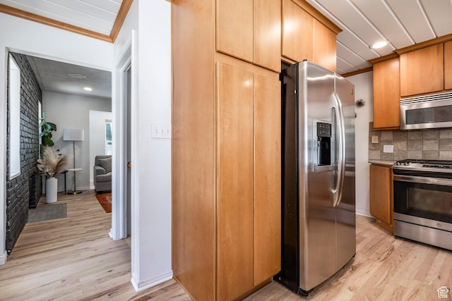 2605 E Simpson Ave, Salt Lake City, UT 84109 - kitchen with stainless steel appliances, light wood-type flooring, decorative backsplash, ornamental molding, and recessed lighting
