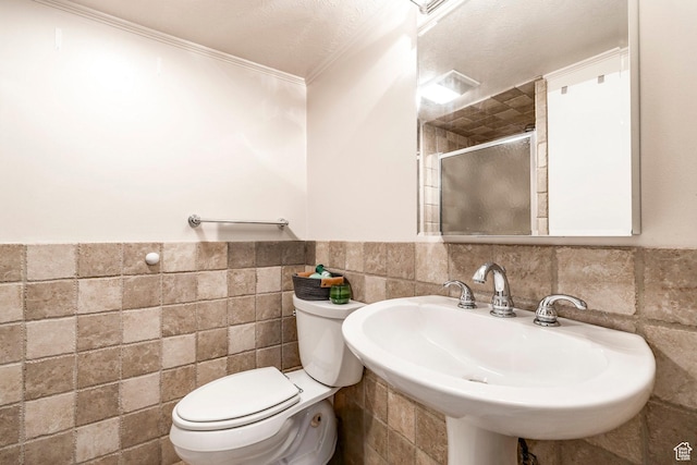 2605 E Simpson Ave, Salt Lake City, UT 84109 - full bath featuring tile walls, a stall shower, ornamental molding, and wainscoting