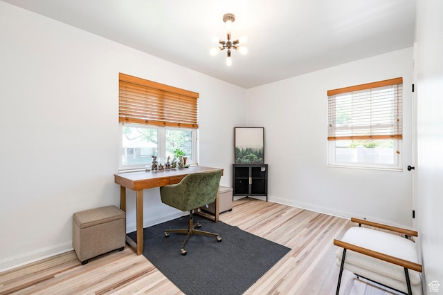 2605 E Simpson Ave, Salt Lake City, UT 84109 - home office with healthy amount of natural light, a chandelier, and light wood-style floors