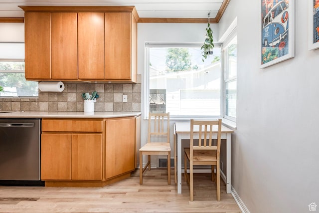 2605 E Simpson Ave, Salt Lake City, UT 84109 - kitchen featuring dishwasher, light countertops, light wood-style flooring, decorative backsplash, and ornamental molding