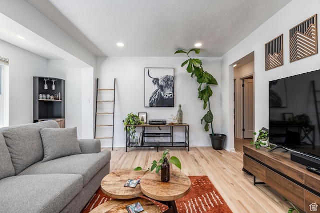 2605 E Simpson Ave, Salt Lake City, UT 84109 - living area with light wood-style flooring, recessed lighting, and a textured ceiling