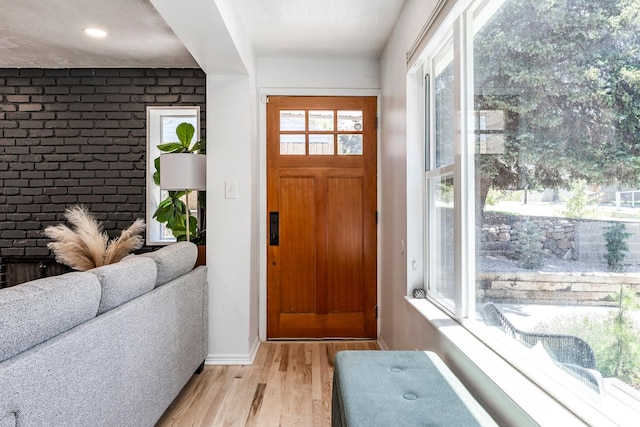 2605 E Simpson Ave, Salt Lake City, UT 84109 - entryway with light wood-type flooring and brick wall