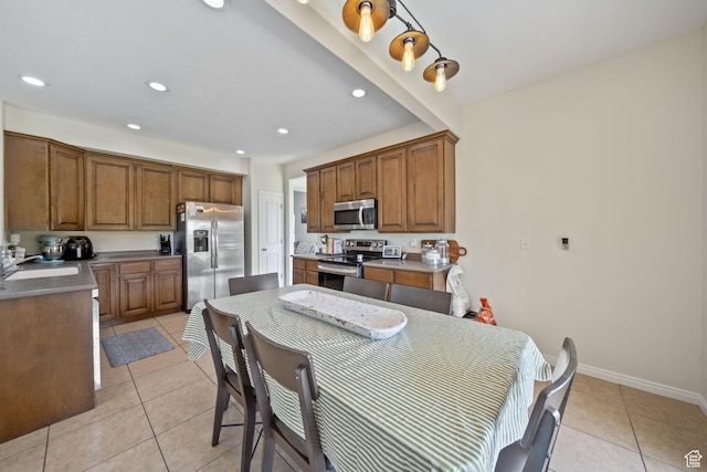 202 S 2035 W, Lehi, UT 84043 - kitchen with stainless steel appliances, light tile patterned floors, brown cabinetry, and recessed lighting