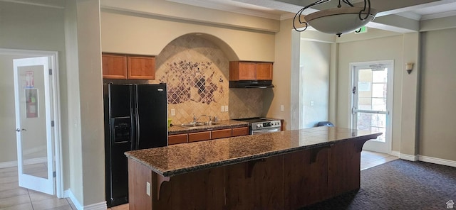 1195 W Dallin Dr Unit R-201, Pleasant Grove, UT 84062 - kitchen with electric stove, black fridge with ice dispenser, dark countertops, brown cabinets, and ornamental molding