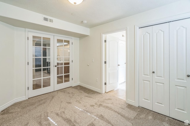 1195 W Dallin Dr Unit R-201, Pleasant Grove, UT 84062 - unfurnished bedroom featuring french doors, carpet, and a closet