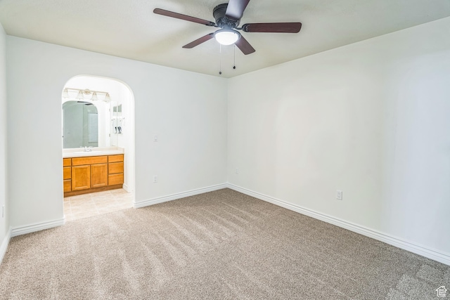 1195 W Dallin Dr Unit R-201, Pleasant Grove, UT 84062 - unfurnished bedroom with light colored carpet, ensuite bathroom, arched walkways, and a ceiling fan