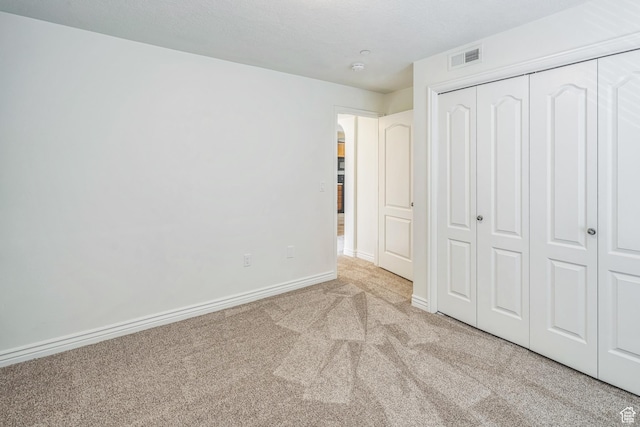 1195 W Dallin Dr Unit R-201, Pleasant Grove, UT 84062 - unfurnished bedroom with carpet floors, a closet, and arched walkways