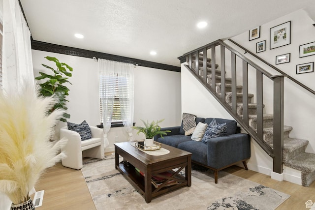 175 Grove Creek Dr N, Pleasant Grove, UT 84062 - living area with stairs, wood finished floors, crown molding, and recessed lighting