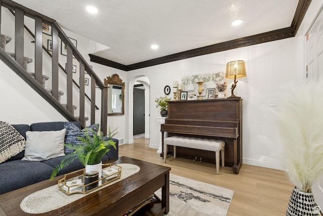 175 Grove Creek Dr N, Pleasant Grove, UT 84062 - living area featuring arched walkways, ornamental molding, wood finished floors, stairway, and recessed lighting