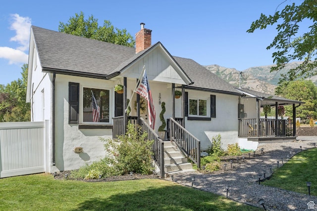 175 Grove Creek Dr N, Pleasant Grove, UT 84062 - view of front facade with a chimney, a front lawn, and roof with shingles