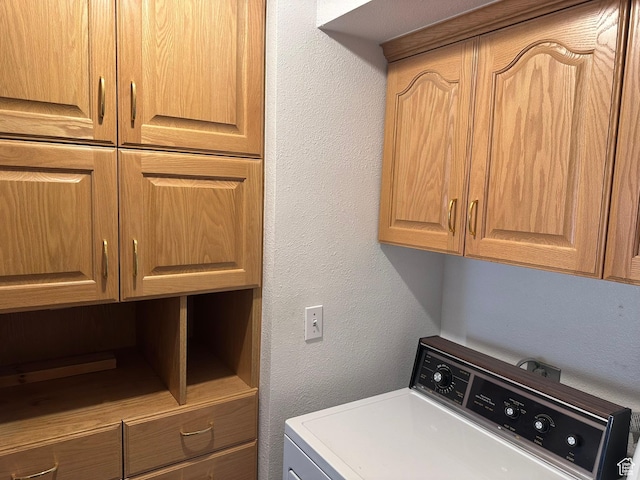 1780 W Homestead Farms Ln S Unit 2, West Valley City, UT 84119 - laundry room with washer / clothes dryer, cabinet space, and a textured wall