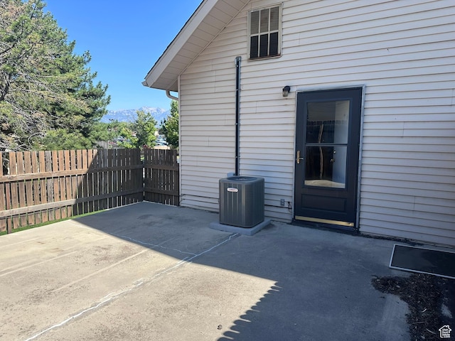 1780 W Homestead Farms Ln S Unit 2, West Valley City, UT 84119 - view of patio featuring a mountain view