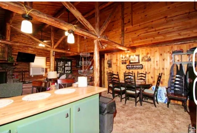 260 E Jensen Trl, Hatch, UT 84735 - dining area with wood walls, high vaulted ceiling, a fireplace, and beam ceiling